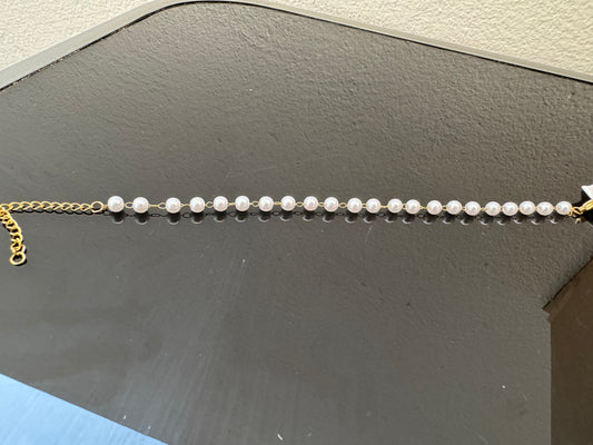 Pulseras dorada con perlas
